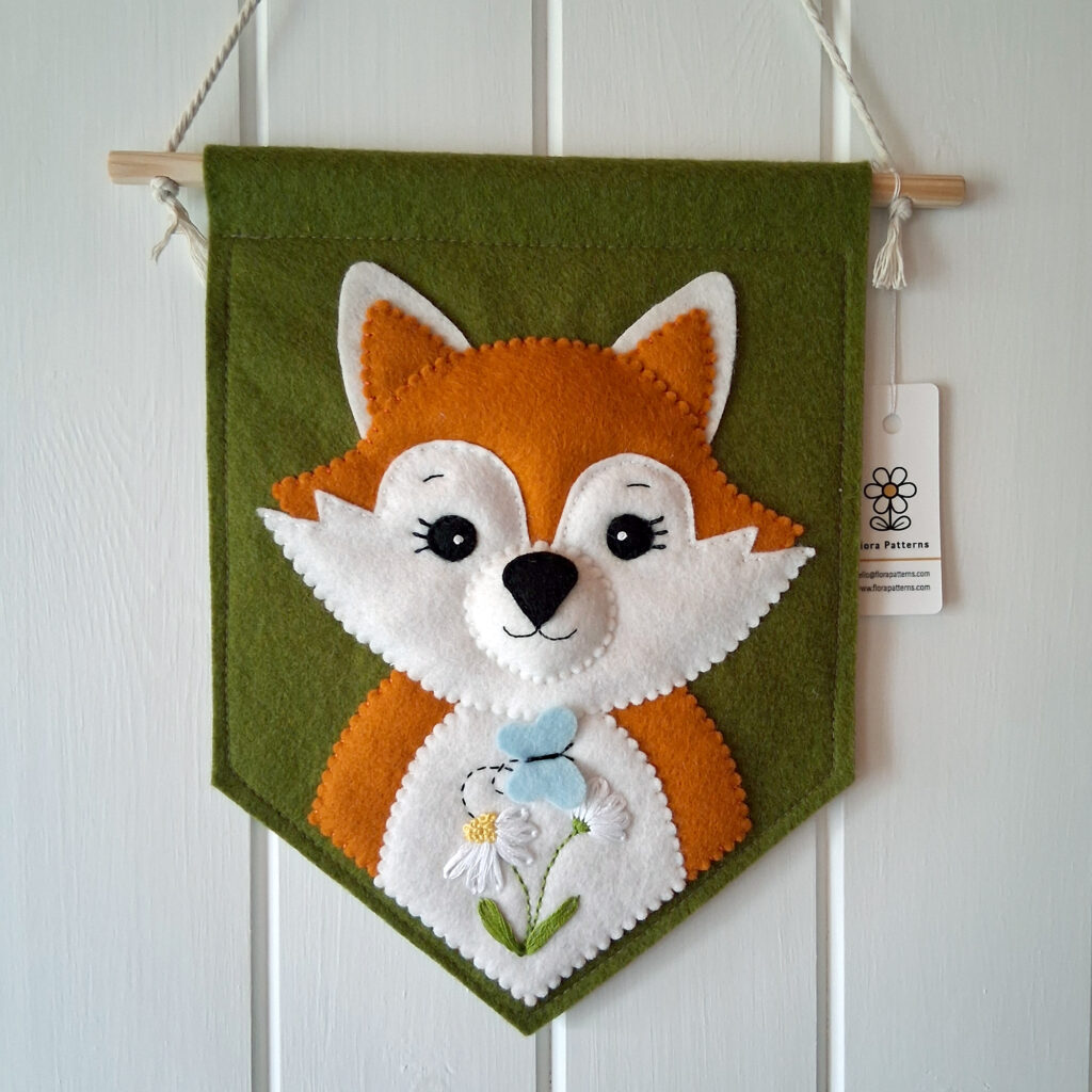 Felt flag with fox face and hand embroidered tummy